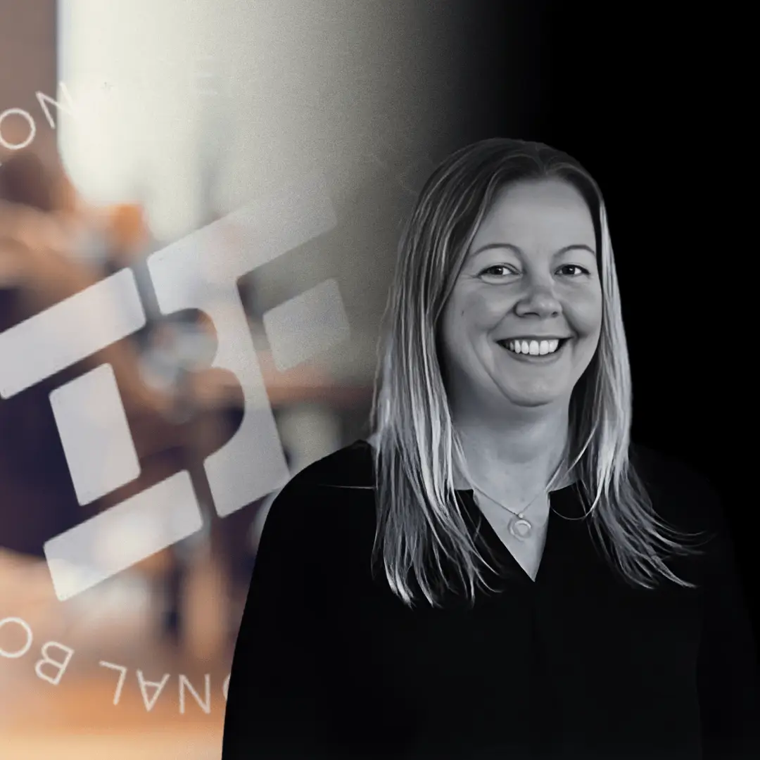 Helena Sundqvist smiling with the IBF logo and meeting table in the background.