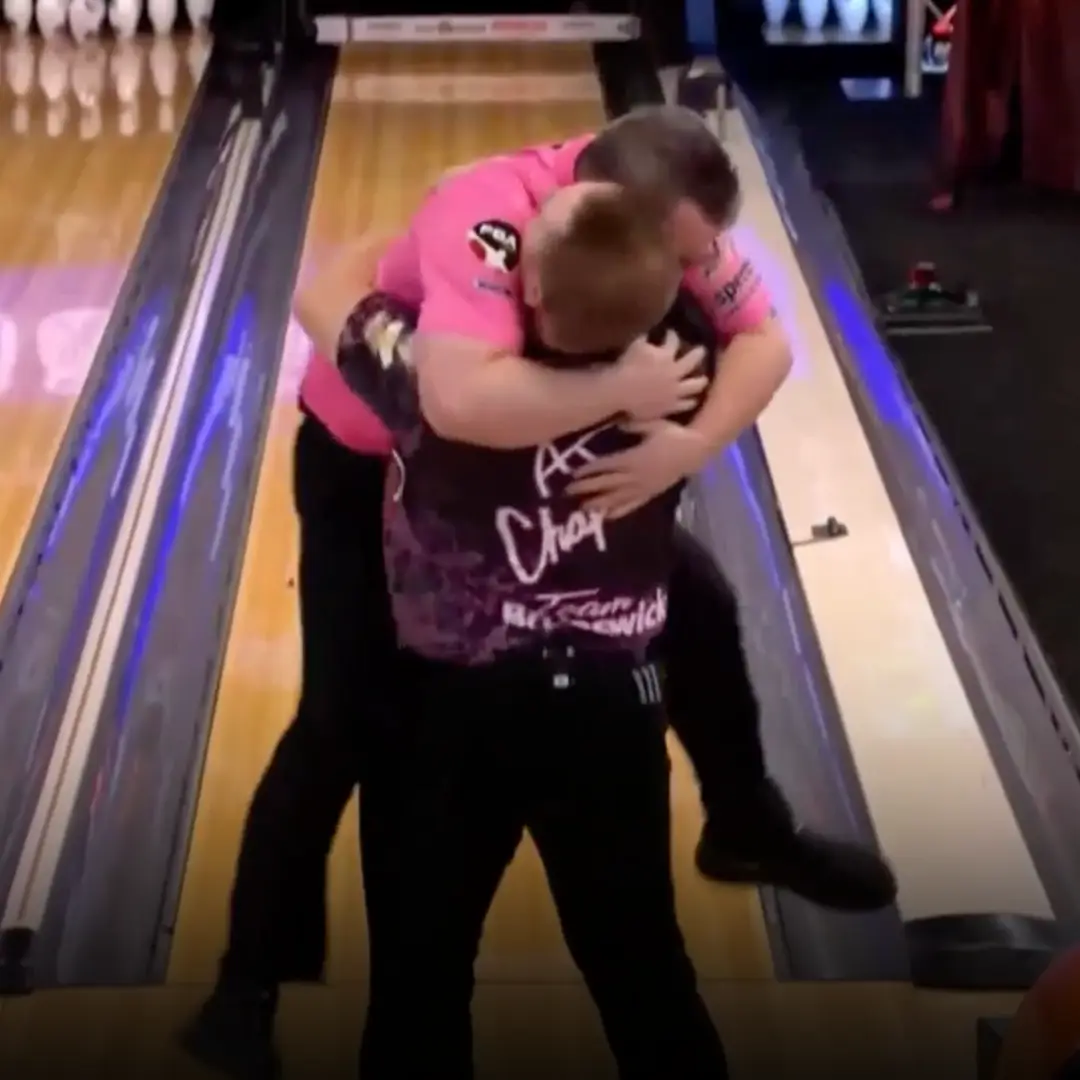 Zach Wilkins and AJ Chapman celebrating with the Roth/Holman Doubles Championship trophy at Bayside Bowl in Portland, Maine